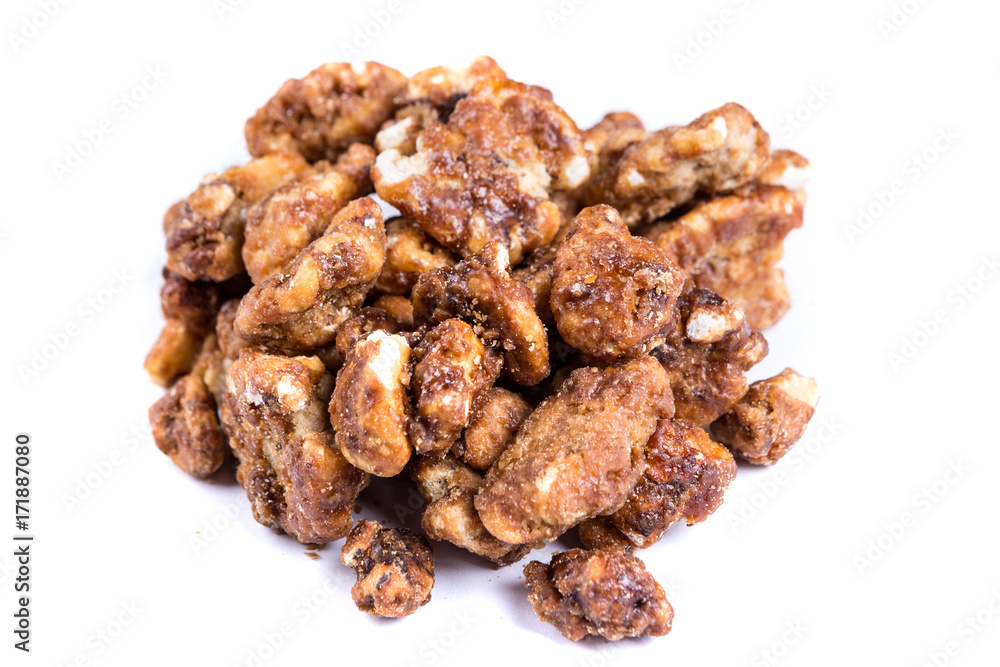 Pile of sugar coated pecans isolated on a white background Pile of sugar coated pecans isolated on a white background