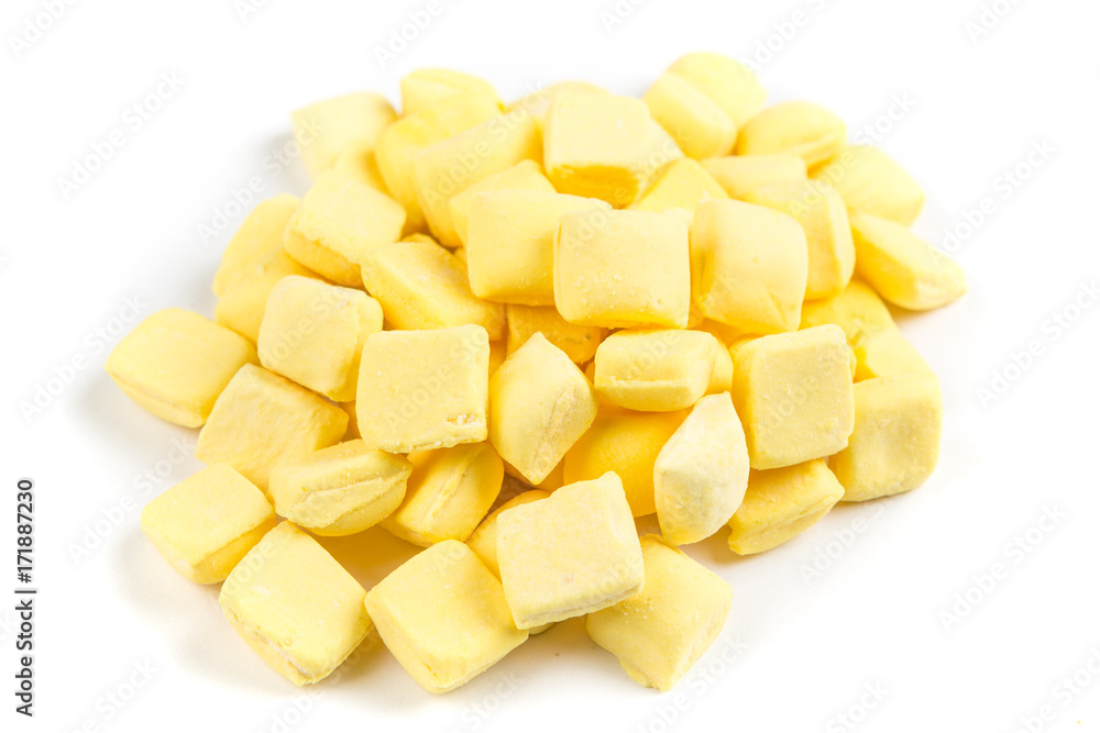 Pile of yellow mints isolated on a white background Pile of yellow mints isolated on a white background