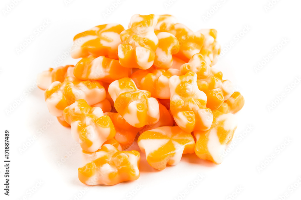 Pile of orange cream jelly bears isolated on a white background Pile of orange cream jelly bears isolated on a white background