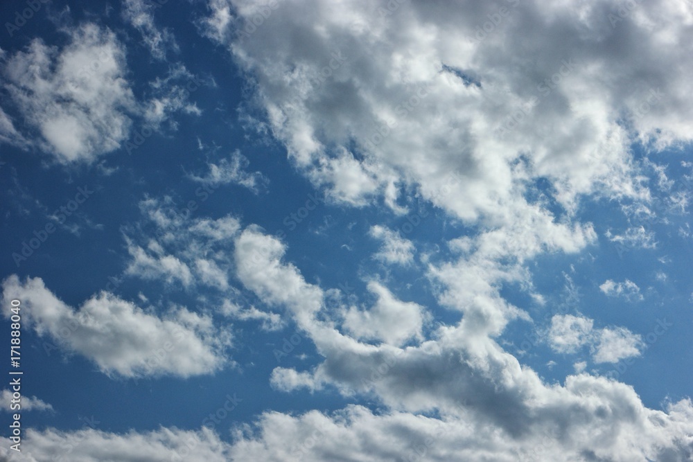 Obraz premium white clouds running on blue sky 