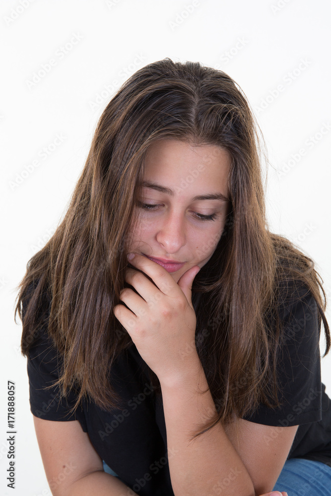 Timid and girl shyly looking ahead, clenched hands into fists Timid and girl shyly looking ahead, clenched hands into fists