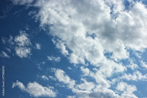 white clouds running on blue sky          