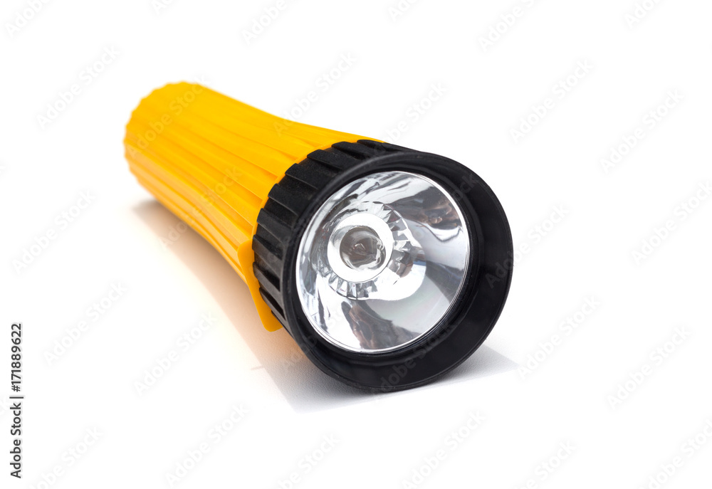 yellow electric flashlight with simple design isolate on white background yellow electric flashlight with simple design isolate on white background