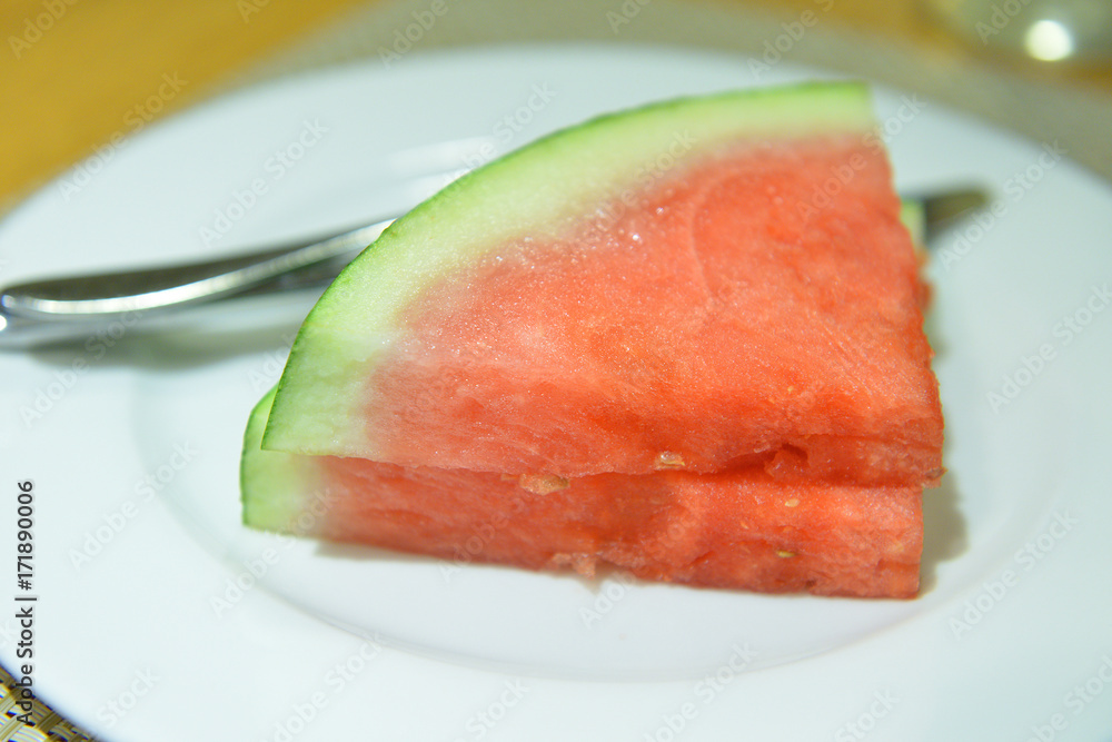 Piece of ripe watermelon on white plate