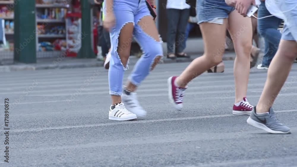 two girls crossing the street two girls crossing the street