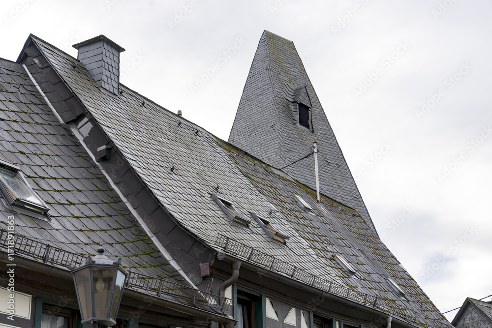 Slate-covered house roofs