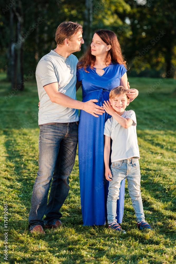 Happy pregnant family of three expecting new baby Happy pregnant family of three expecting new baby