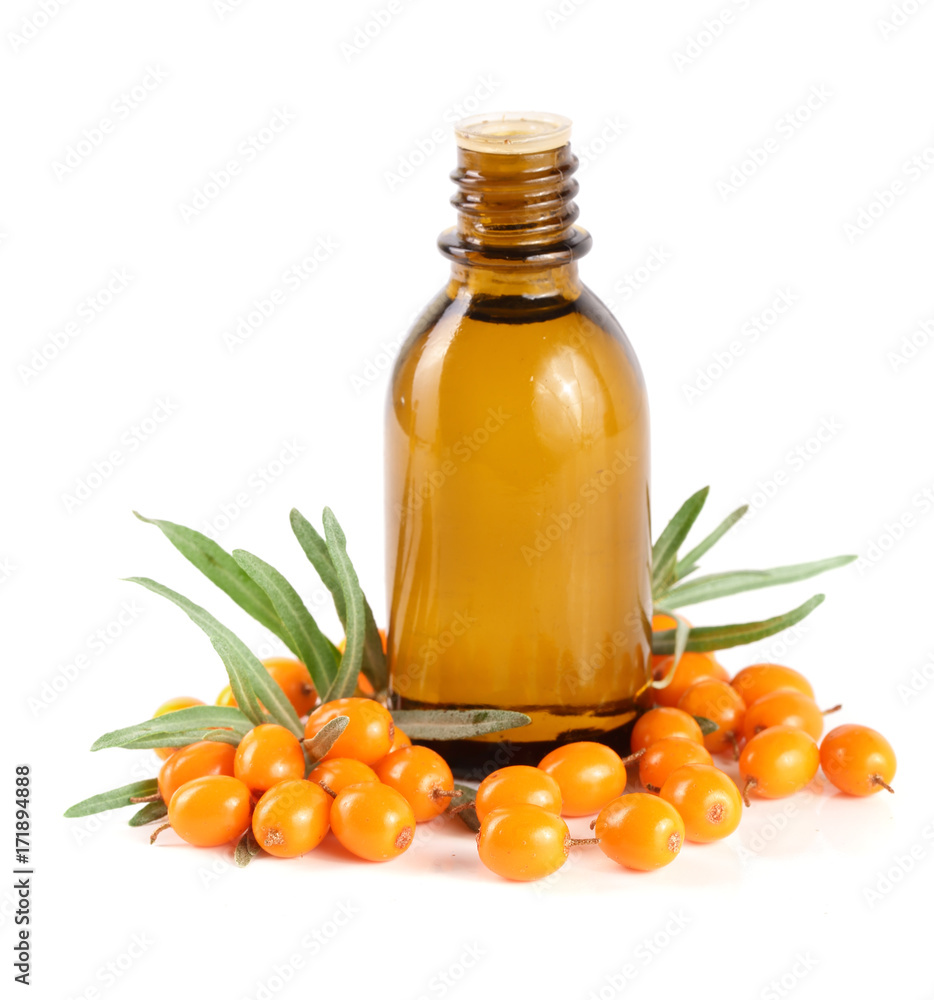 Sea-buckthorn oil with berries and leaves isolated on white background Sea-buckthorn oil with berries and leaves isolated on white background