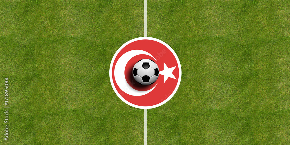 Naklejka premium Turkey flag on a soccer field center