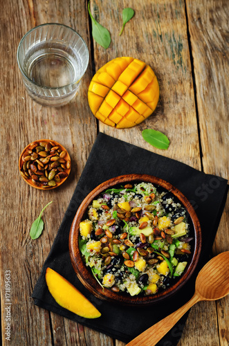 Mango black bean arugula pumpkin seed quinoa salad