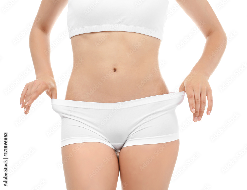 Young woman in underwear on white background. Diet concept - obrazy, fototapety, plakaty 