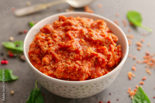 Meat sauce in ceramic bowl on kitchen table