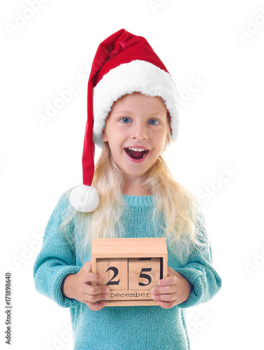 Cute girl in Santa hat with...