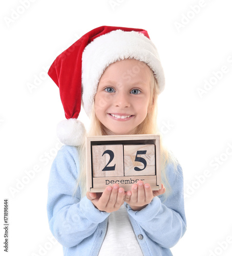 Cute girl in Santa hat with...