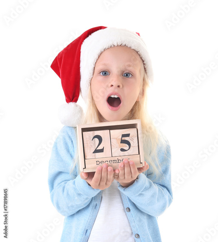 Cute girl in Santa hat with...