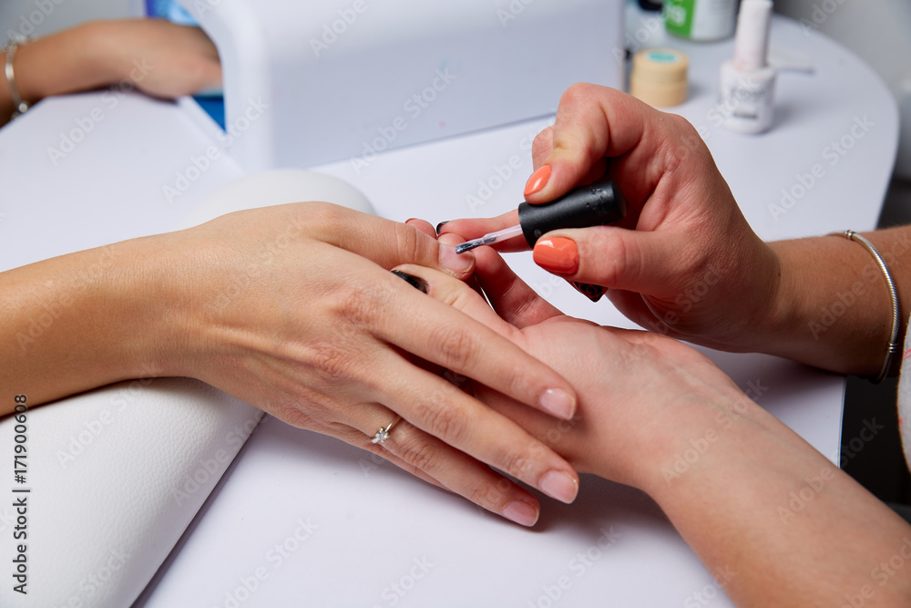 manicure salon applied varnish on the nails manicure salon applied varnish on the nails