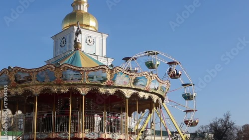 Kyiv (Kiev), Ukraine - January 2, 2017. Carousel in Saint Sophia Square during Christmas holidays.  Beautiful cityscape