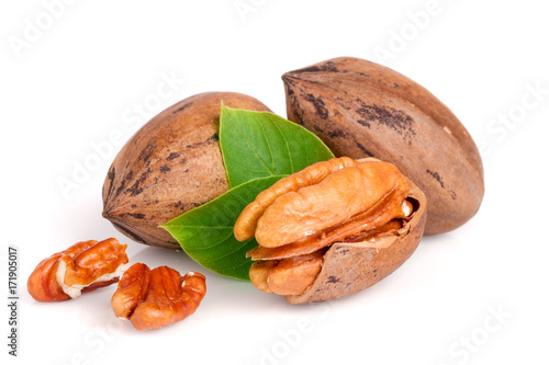 Three pecan with leaves isolated on white background