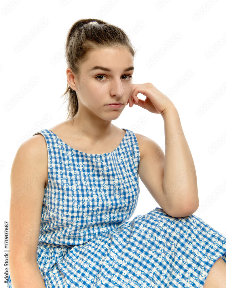 Cute teenage girl in casual dress looking at camera on white Cute teenage girl in casual dress looking at camera on white