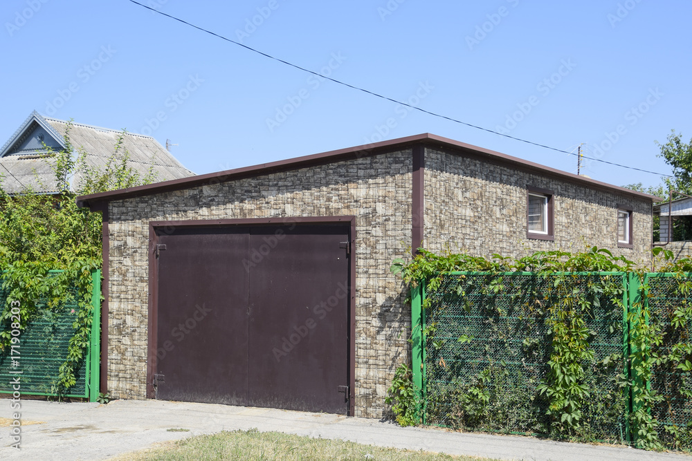 Car garage of corrugated metal profile. Car garage of corrugated metal profile.