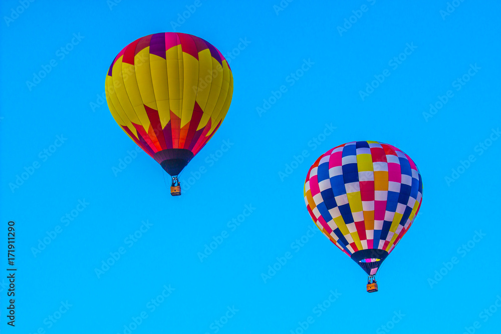 Naklejka premium Two Multi Colored Hot Air Balloons
