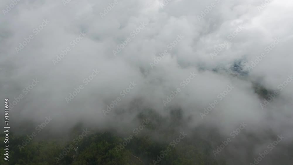Flying through clouds over lake and mountains, 4k
Flying through clouds over lake and mountains, 4k