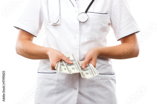 Woman doctor with stethoscope and currencies dollar, corruption or bribe concept