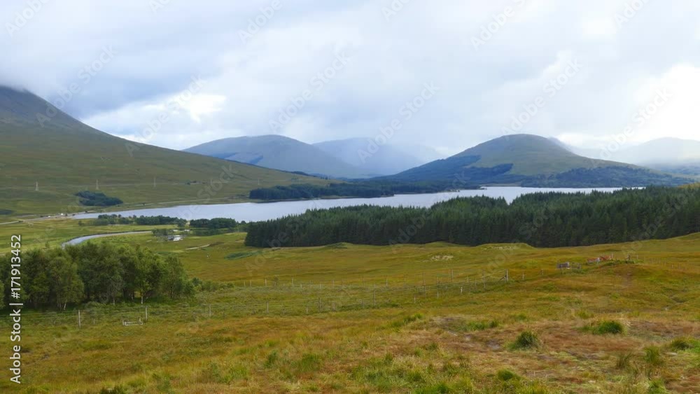 Beautiful landscape. Mountains, a lake, a field and a forest. Beautiful landscape. Mountains, a lake, a field and a forest.