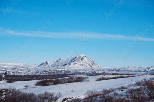 Landscape snow field with mountain and blue sky in winter