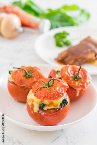  baked tomatoes stuffed with cheese and spinach