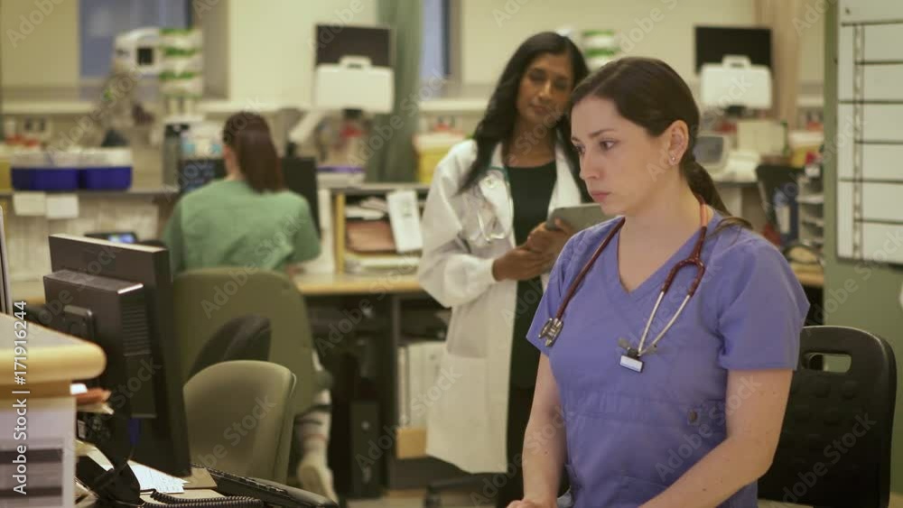 Nurses and Doctors working together in a modern busy hospital. Nurses and Doctors working together in a modern busy hospital.