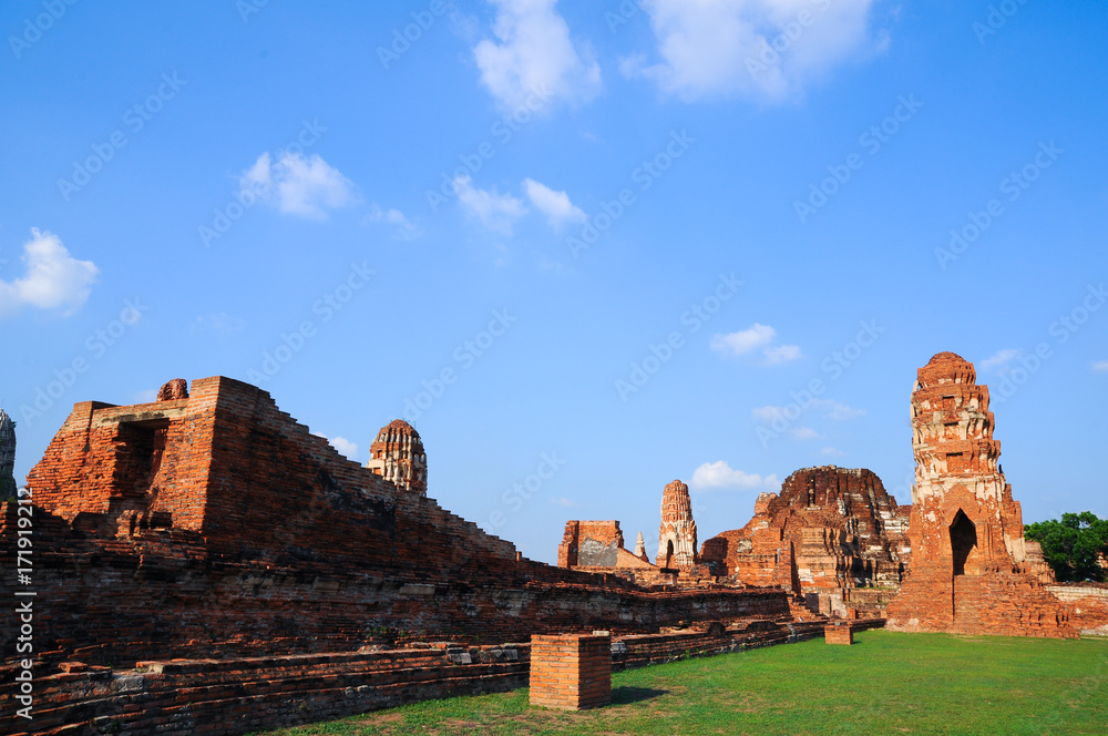 Wat Mahathat, a ruined ancient Buddhist temple with blue sky / Wat Mahathat, a ruined ancient Buddhist temple with blue sky in Ayutthaya province, Thailand