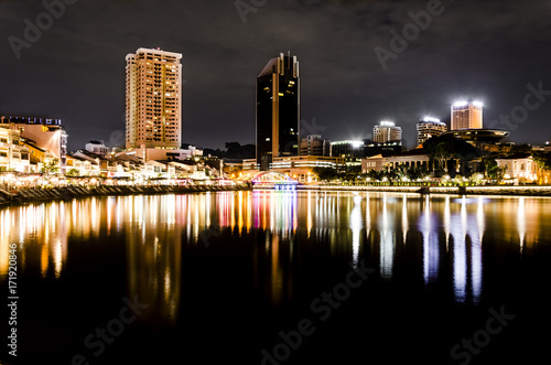 singapore skyline during night, view of Singapore lights reflecting over the water.