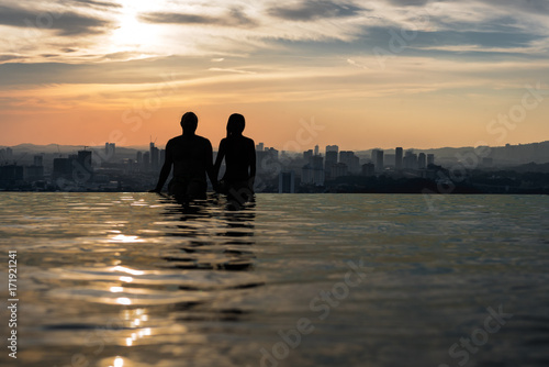Photography Sitting on the edge of an infinity pool looking at the panoramic view