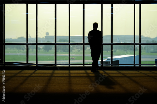 Silhouette of people in the airport / Silhouette of people in the airport at morning time, Thailand