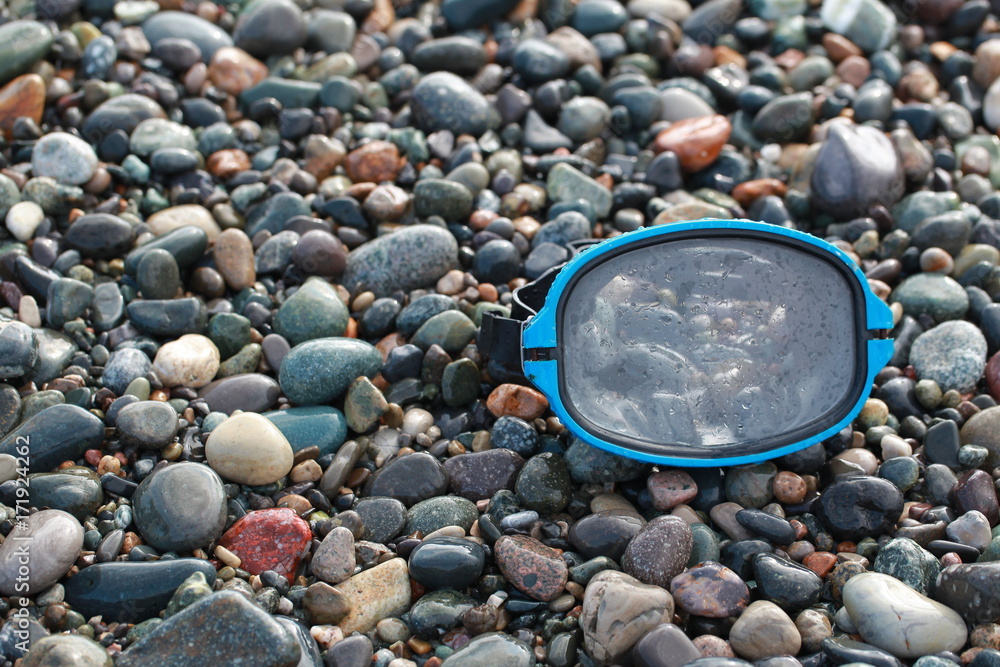 mask for scuba diving on a pebble beach mask for scuba diving on a pebble beach