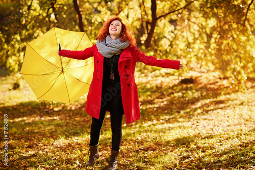 Happy girl in nature with umbrella © luckybusiness