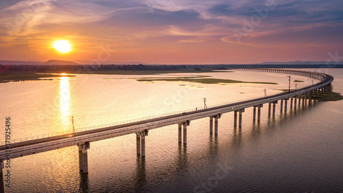 Railroad bridge Over River Pa Sak Dam Lopburi Thailand and Beautiful sunset