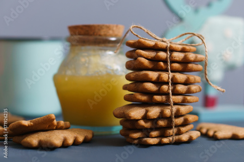 Ginger cookies with honey, tea and moose on thebackground photo