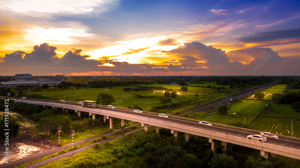 Aerial Photo Countryside Car Running on Road Bridge Over Railway and Golden Hour Sky Beautiful Landscape Drone View Aerial Photo Countryside Car Running on Road Bridge Over Railway and Golden Hour Sky Beautiful Landscape Drone View