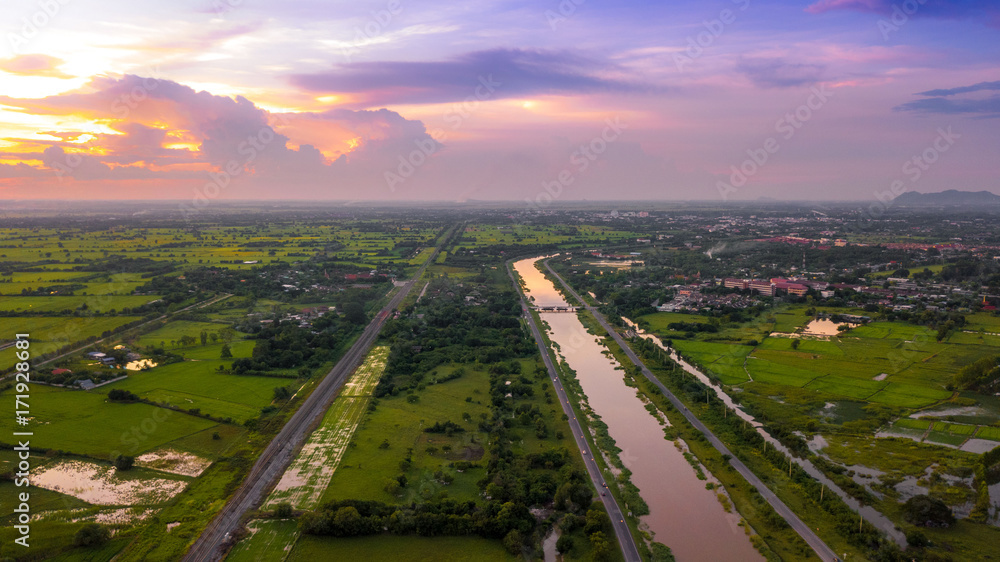 Aerial Photo canal and Railway Countryside Green Field Beautiful Sky Lopburi Thailand