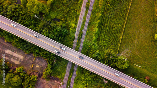 Aerial Photo Countryside Car Running on Road Bridge Over Railway Bypass route the City Drone Top View
