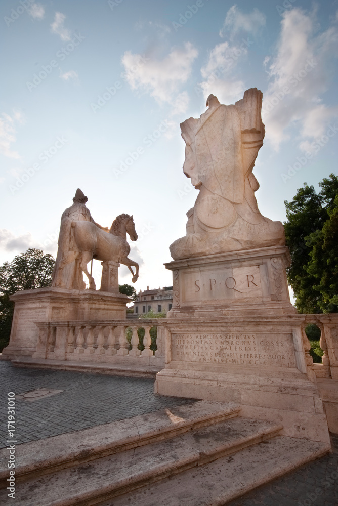 Marble statues of the Dioscuri, Castor and Pollux, at the top of the staircase, in Capitol Square or Piazza del Campidoglio, Rome, Italy.