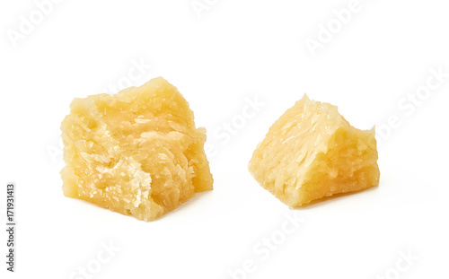 Pieces of Parmesan cheese on white background. Macro photography with great depth of field. DoF .