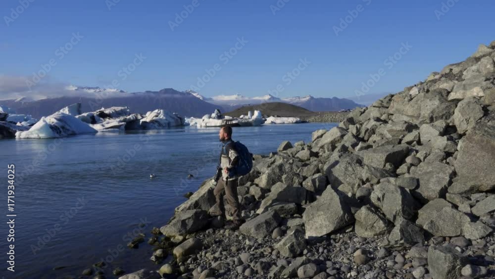 Woman explorer at Jokulsarlon lagoon, Iceland. Woman explorer at Jokulsarlon lagoon, Iceland.