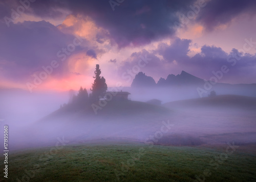 Dolomites misty highlands at beautiful dawn