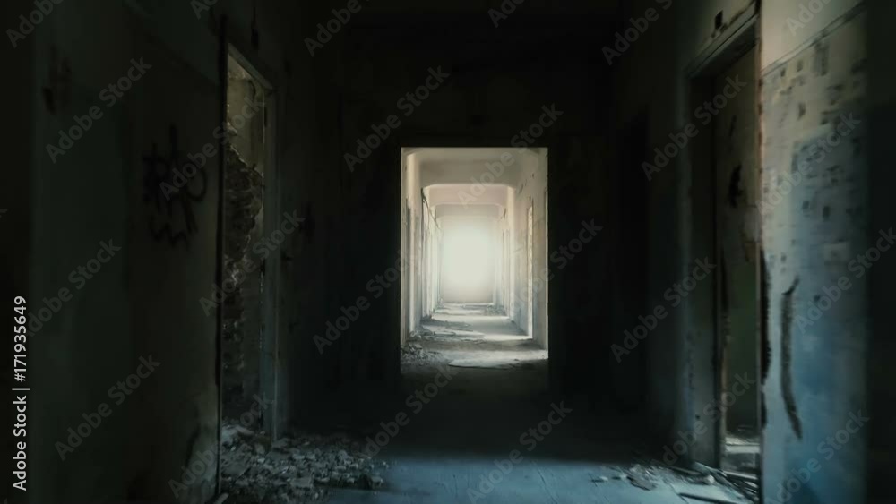 Backtracking drone dolly shot inside a long corridor/hallway of a destroyed by an earthquake and evacuated building. Backtracking drone dolly shot inside a long corridor/hallway of a destroyed by an earthquake and evacuated building.