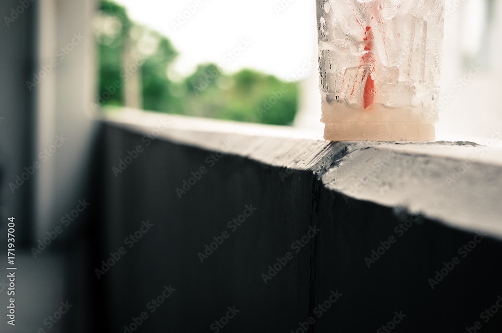 garbage of iced coffee in glass, water drops on the plastic glass of iced coffee, garbage concept, pollution concept in the city garbage of iced coffee in glass, water drops on the plastic glass of iced coffee, garbage concept, pollution concept in the city