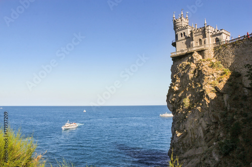 Castle on a rocky shore.