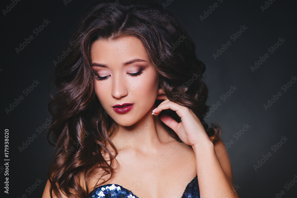 Perfect make-up and hairstyle. Portrait of beautiful curly brunette woman
